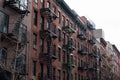 Row of Old Brick Buildings on the Lower East Side of New York City with Fire Escapes Royalty Free Stock Photo