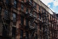 Row of Old Brick Buildings on the Lower East Side of New York City with Fire Escapes Royalty Free Stock Photo