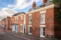 Row of old brick houses along a deserted street a residential district Royalty Free Stock Photo