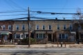 Row of Old Brick Neighborhood Homes along an Empty Street and Sidewalk in Astoria Queens New York