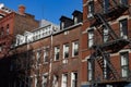 Row of Old Brick Residential Buildings with Fire Escapes in Greenwich Village of New York City Royalty Free Stock Photo