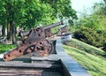 Row of old cannons on wall of Chernihiv, Ukraine. Middle Ages mortars in park Royalty Free Stock Photo