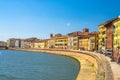 Row of old colorful buildings houses on embankment promenade of Arno river in historical centre of Pisa Royalty Free Stock Photo