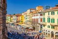 Row of old colorful multicolored buildings on Piazza Bra square