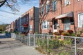 A Row of Old Fenced In Homes in Astoria Queens New York