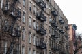 Row of Old Generic Apartment Buildings with Fire Escapes in the East Village of New York City Royalty Free Stock Photo