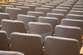 Row of old grey seats in cinema