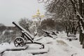 Row of old iron cannons in winter park Royalty Free Stock Photo