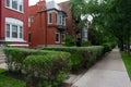 Row of Old Red Brick Homes and the Sidewalk in Lincoln Park Chicago Royalty Free Stock Photo