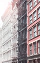 Row of old residential buildings with iron fire escapes, color toning applied, New York City, USA Royalty Free Stock Photo