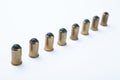 A row of old rubber bullets on a white background Royalty Free Stock Photo