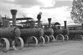 Row of old steam engines (black and white)