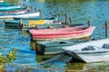 Row of old vintage colorful boats on the lake of Enghien les Bains near Paris France Royalty Free Stock Photo