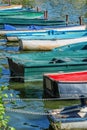 Row of old vintage colorful boats on the lake of Enghien les Bains near Paris France Royalty Free Stock Photo