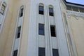 A row of old windows on the gray brown concrete wall Royalty Free Stock Photo