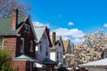 Row of Old Wood Homes in Woodside Queens New York next to a Flowering Tree during Spring Royalty Free Stock Photo