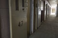 Row of open cell doors in prison