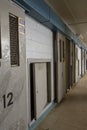 Row of open cells in abandoned prison Royalty Free Stock Photo