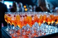 Row of Orange Cocktails. Generative AI Royalty Free Stock Photo