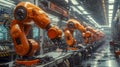 Row Of Orange Robotic Arms In A Modern Manufacturing Facility With Illuminated Control Panels Royalty Free Stock Photo