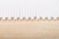 Row of paper straws laying on a wood table