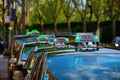 Row of Parisien taxis in the Republique District of Paris France