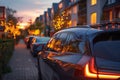 A row of parked cars on a city street with solar panels on their roofs Royalty Free Stock Photo