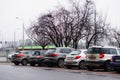 Row of parked cars on parking places in Poznan, Poland.