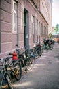 Row of parked colorful bikes on a street