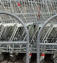 A row of parked shopping carts trolleys Royalty Free Stock Photo