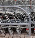 A row of parked shopping carts trolleys Royalty Free Stock Photo