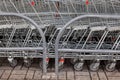 A row of parked shopping carts trolleys Royalty Free Stock Photo