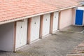 Row of parking garages at building apartment parked private