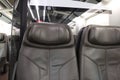 Row of Passenger`s brown leather seat of first class on high speed train, empty comfortable luxury vehicle chair, public transport