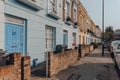 Row of pastel coloured terraced houses in Camden, London, UK