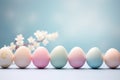 Row of pastel pink and blue easter eggs arranged neatly in a line on a table for festive decoration Royalty Free Stock Photo