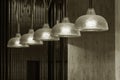 Row of pendant light lamps set in modern interior in black and white Royalty Free Stock Photo