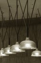 Row of pendant light lamps set in modern interior in black and white Royalty Free Stock Photo