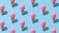Row of pink ice cream cones. Minimalist isometric concept. Royalty Free Stock Photo