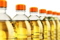 Row of plastic bottles with vegetable cooking oil