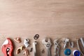 Row of plumbing materials and tools on wooden workbench top Royalty Free Stock Photo