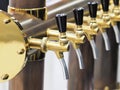 Row of polished beer taps Royalty Free Stock Photo