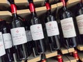 Row of Pomerol and Saint-Emilion Bottles, Classified Growths bottles French wines display for sell in the supermarket shelves