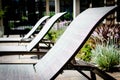 Row of poolside lounge chairs Royalty Free Stock Photo