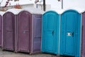 A row of portable rent toilets Royalty Free Stock Photo