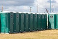 a row of portable toilets ready for a festival