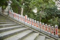 Row of Posts along Stairs with Japanese Writing Royalty Free Stock Photo