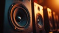 Row of powerful modern audio speakers in warm ambient light creating an immersive sound experience in a studio setting Royalty Free Stock Photo
