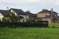 A row of private houses under a brown tiled roof Royalty Free Stock Photo