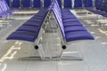 Row of purple chair decoration at airport terminal waiting area interior for modern building Royalty Free Stock Photo